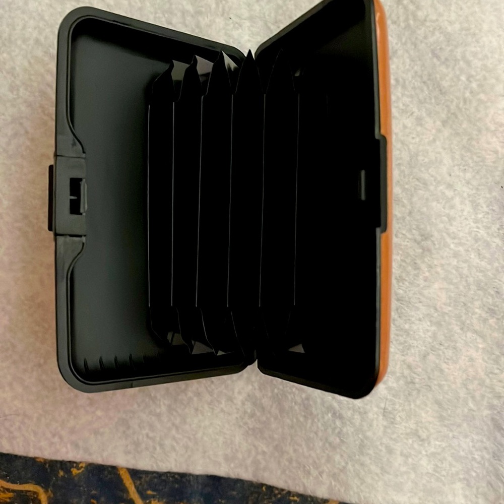 Gold metallic plastic credit card holder